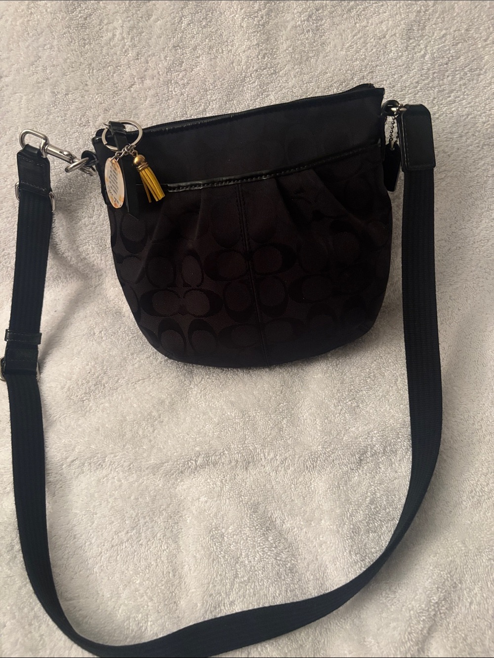 Coach Black Signature Mini Crossbody with Yellow Tassel Charm